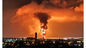 Explosion at Putin's oil refinery causes massive fire with flames reaching 200ft into the sky.