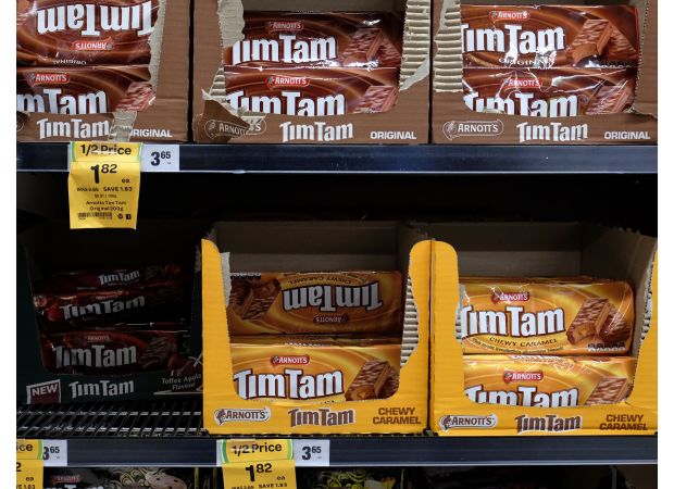 Major Australian supermarkets deny responsibility for expensive Tim Tams.