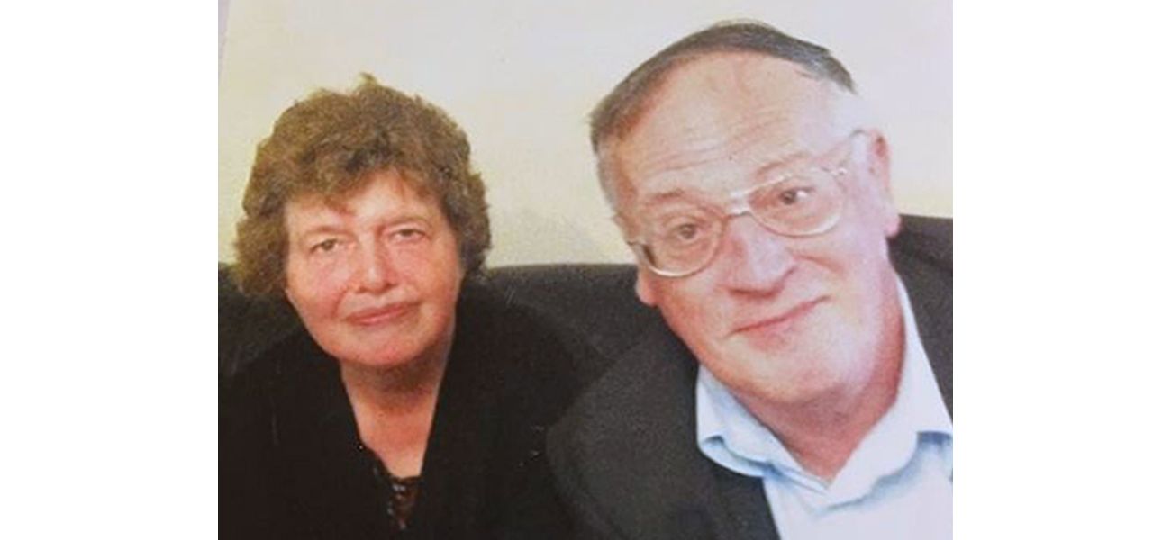 Woman sentenced to life in prison for killing parents and creating homemade grave in house.