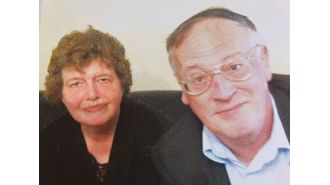 Woman sentenced to life in prison for killing parents and creating homemade grave in house.