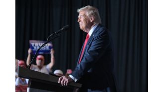 Trump angrily targets migrants at Aurora rally, promising to aggressively pursue gang members.