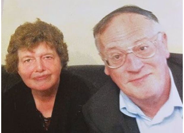 Woman sentenced to life in prison for killing parents and creating homemade grave in house.