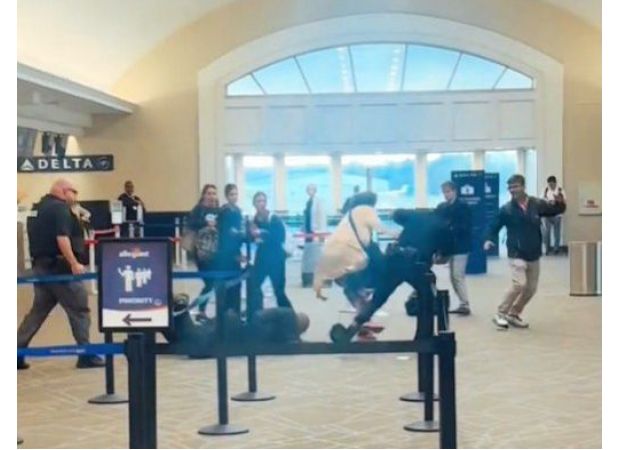 Airline customer threatens to 'kill' cops after jumping behind check-in counter.