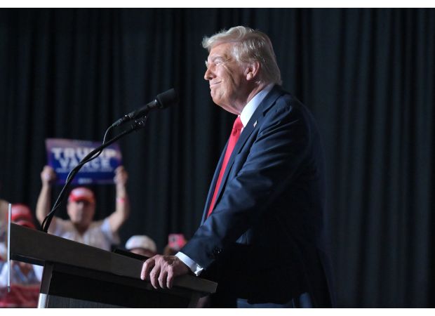 Trump angrily targets migrants at Aurora rally, promising to aggressively pursue gang members.