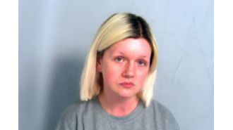Woman sentenced to life for murdering parents, kept their bodies in home with her.