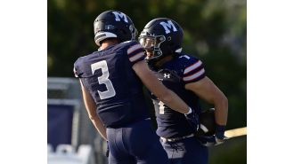 Foster's four touchdowns lead Colorado Mines to an easy win over South Dakota Mines in football.