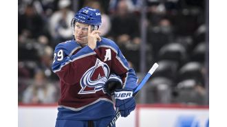 Jokic gives MacKinnon Hart Trophy before Avalanche home opener, acknowledging him as an MVP.