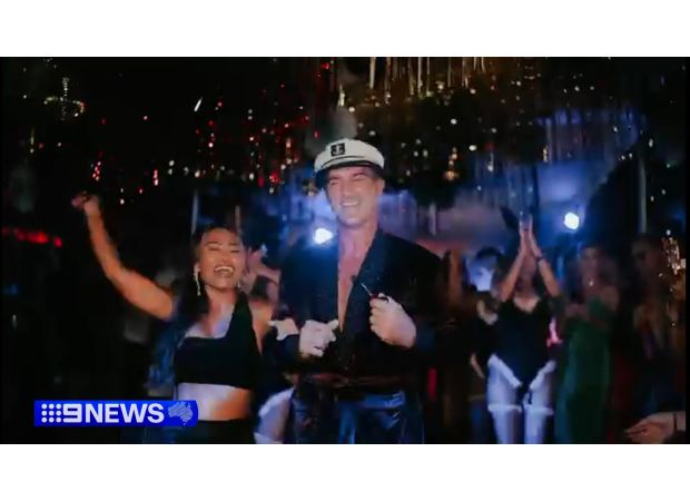 Police in Bali arrest the wife of a former Essendon football player in raids on sex spas.