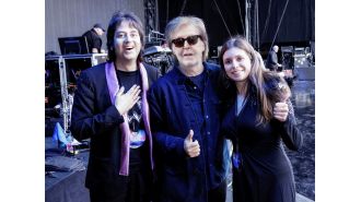 Paul McCartney makes super-fans' dream come true by helping them get engaged during his concert.