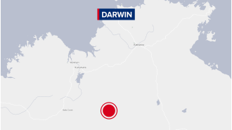 Man detained by police after being accused of killing female in Northern Territory town.