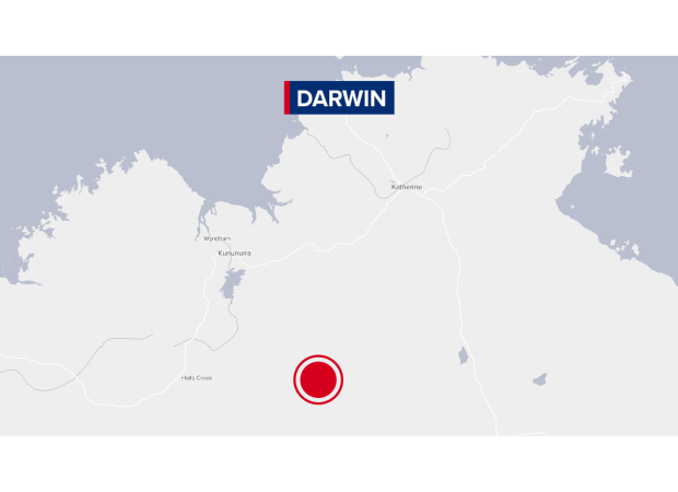 Man detained by police after being accused of killing female in Northern Territory town.