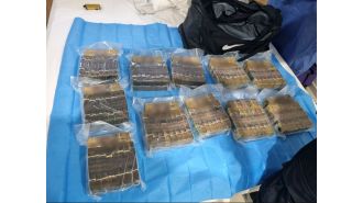 Police find large sum of money during traffic stop at Brisbane house, totaling $1 million.