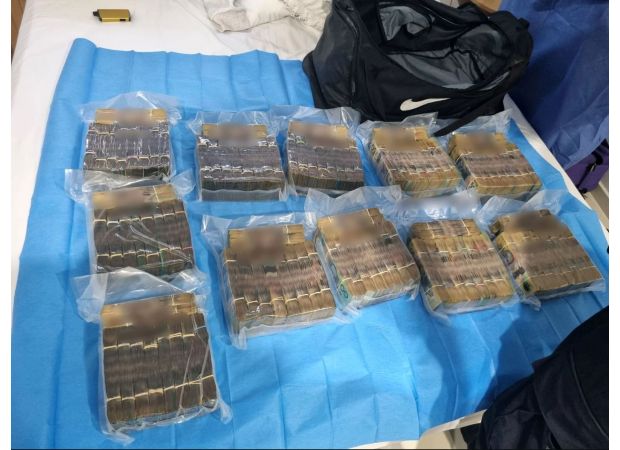 Police find large sum of money during traffic stop at Brisbane house, totaling $1 million.