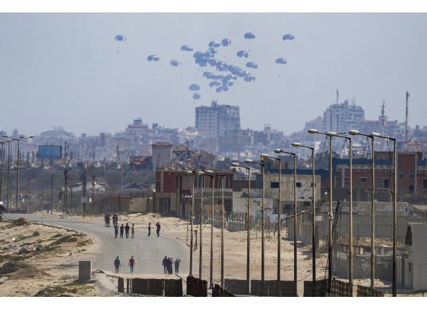 Feral dogs are feasting on corpses in northern Gaza's roads.