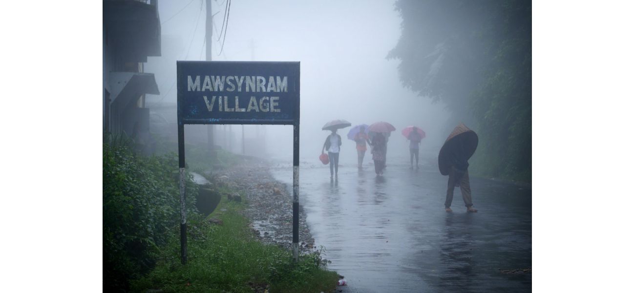 The wettest spot on Earth where people live in stilt houses and use full-body umbrellas.