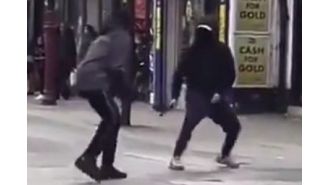 A violent machete brawl occurs in front of kids on busy London street.
