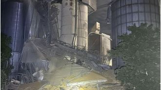 Emergency response teams sent to scene after massive grain containers cave in, potentially causing hazardous material spill