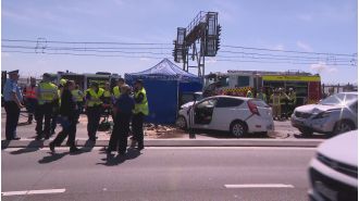 Biker accused of driving through bridge crash scene faces charges.