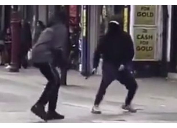 A violent machete brawl occurs in front of kids on busy London street.