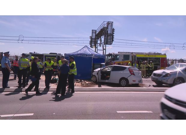 Biker accused of driving through bridge crash scene faces charges.