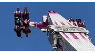 Kids stuck in air for 15 mins when ride at fair stops working.