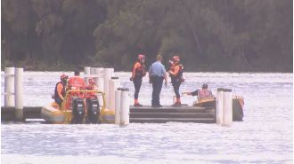 Police are urgently looking for two missing kids following a woman's drowning in a Sydney bay.