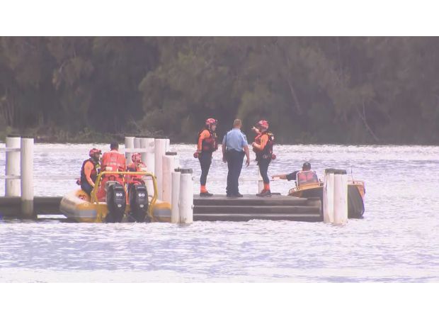 Police are urgently looking for two missing kids following a woman's drowning in a Sydney bay.