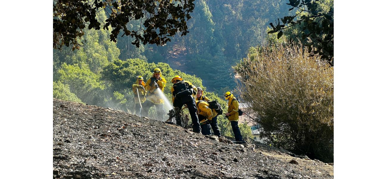 Oakland hills fire now half controlled with five alarms