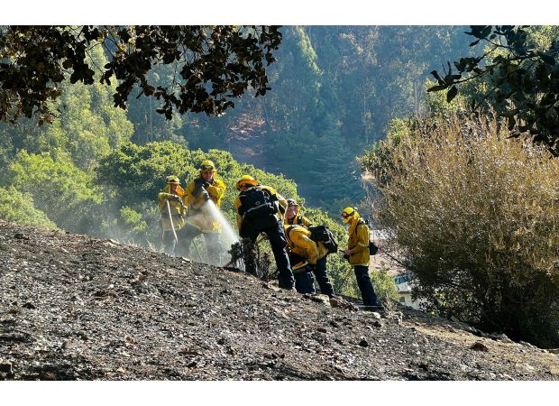 Oakland hills fire now half controlled with five alarms