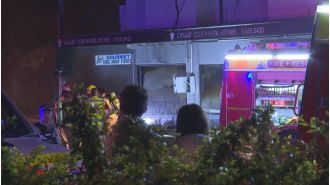 Police search for witnesses and evidence following a suspicious fire that destroyed a cafe in Bondi.