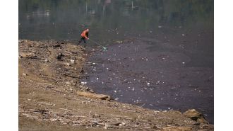 Lake ruined by tons of trash.