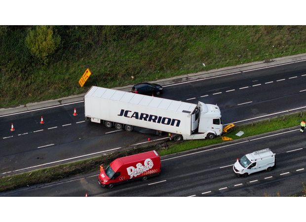 A truck's jackknifing on a dual carriageway leads to major traffic delays.
