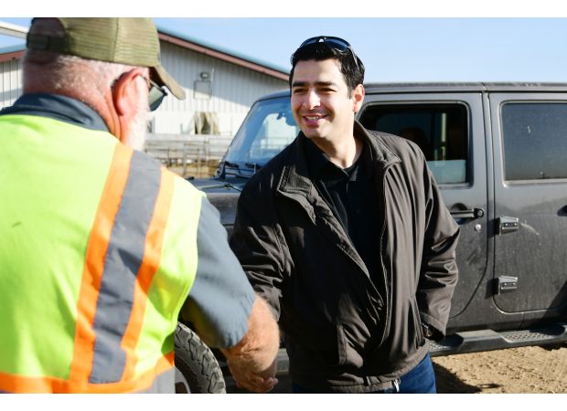 Ex-cop Gabe Evans runs for Congress, navigating Trump controversy.