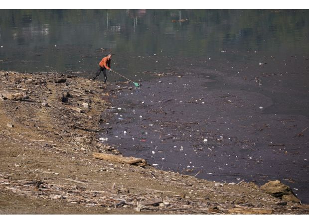 Lake ruined by tons of trash.