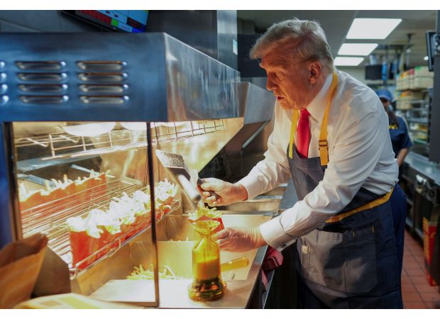 Trump trolls Harris by working at Mickey D's drive-through