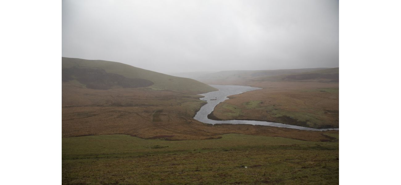 A person's body was found in a wetsuit in a reservoir in Wales.