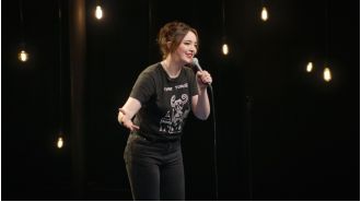 Comedian Fern Brady's controversial breastfeeding tour poster triggers official probe.