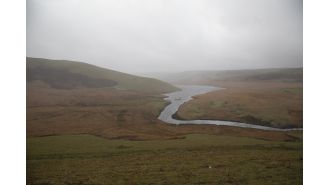 A person's body was found in a wetsuit in a reservoir in Wales.