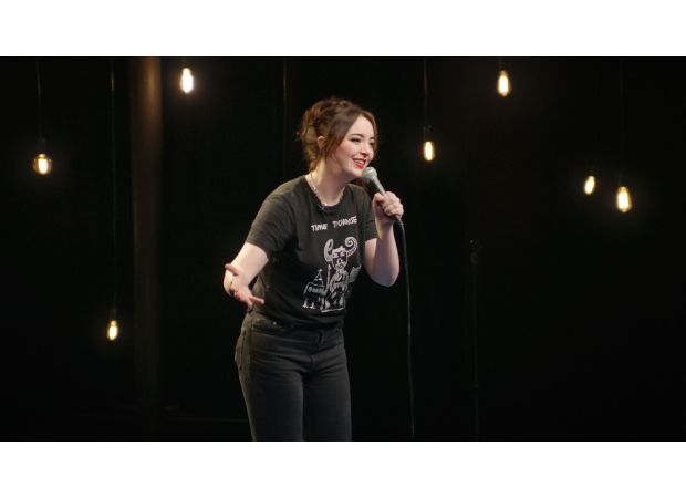 Comedian Fern Brady's controversial breastfeeding tour poster triggers official probe.