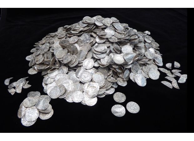 A group of seven treasure seekers discover ancient coins and make £4,300,000 by selling them.