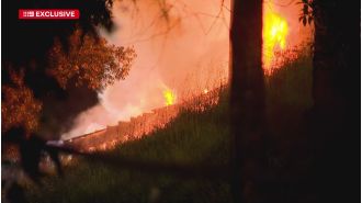 A truck fire on Queensland motorway causes toxic fumes and shuts down the road.