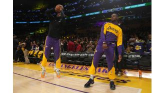 LeBron and his son Bronny create a new record as the first father-son pair in the NBA to play on the same team.