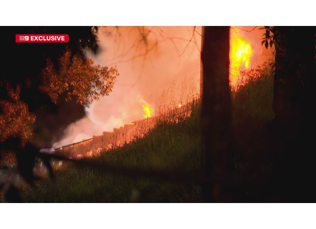 A truck fire on Queensland motorway causes toxic fumes and shuts down the road.
