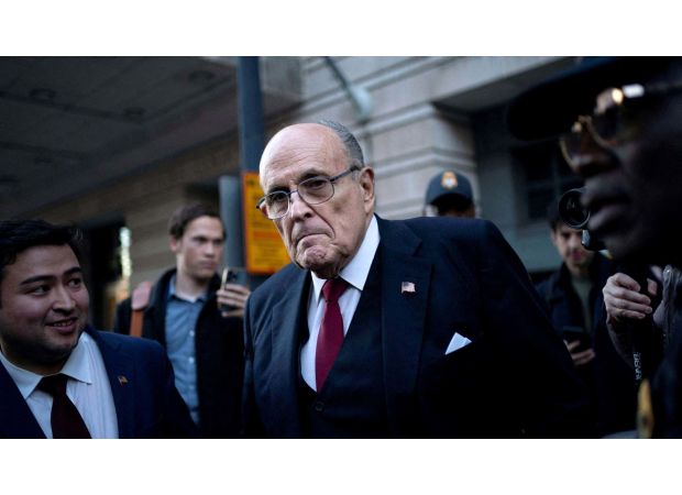 Giuliani must give apartment and memorabilia to workers he defamed.