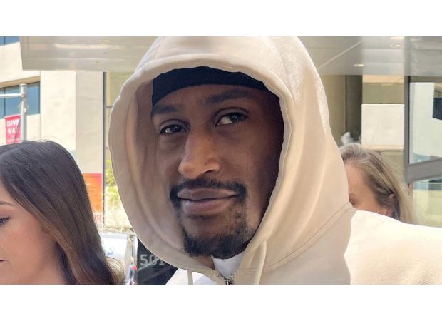 UK rapper charged with rape sends love to supporters as he exits court in Perth, Australia.