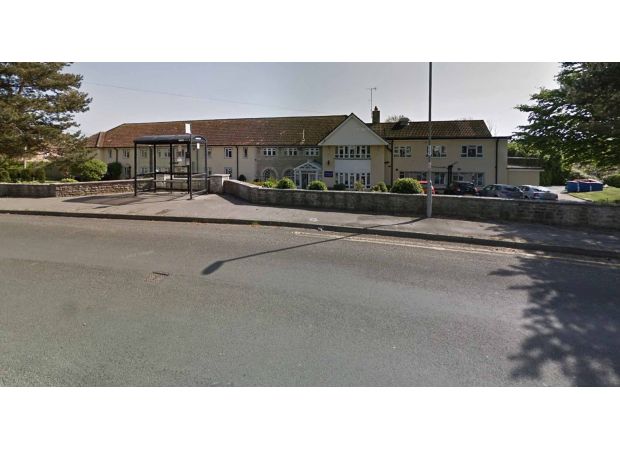 Nursing home cleared out due to serious event, causing emotional distress for staff outside.
