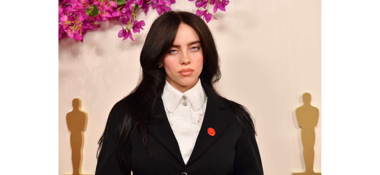 Billie Eilish shows fans her injury from falling on stage in a photo.