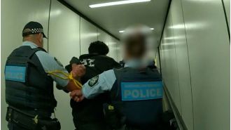 Airline passenger arrested for allegedly assaulting someone during mid-flight on Australian flight.