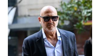 A restaurant owner admits to showing a swastika at a rally supporting Palestine.