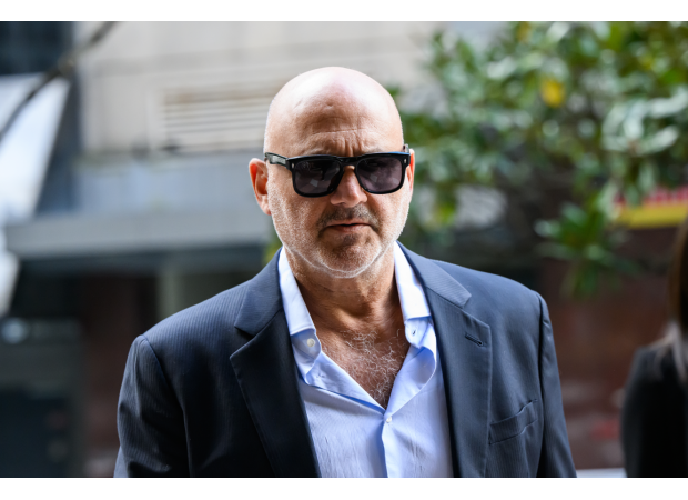 A restaurant owner admits to showing a swastika at a rally supporting Palestine.